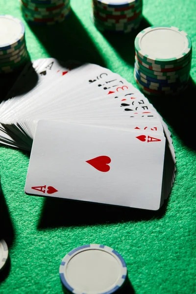 Casino Hold'em live dealer table on huskyslot mobile app showing community cards and betting buttons